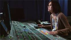 Image of woman working with sound mixers