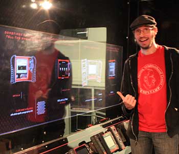 Image of Evan posing alongside the installation